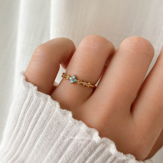 Statement Grey gold ring featuring an aqua opal blossom, vine leaf details, and sparkling cubic zirconia stones.