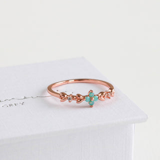 Statement Grey rose gold vine ring featuring a delicate aqua opal blossom and sparkling cubic zirconia accents.