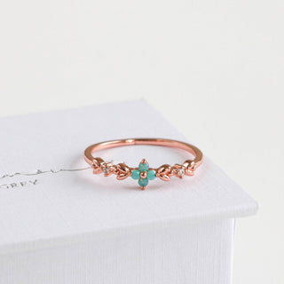 Statement Grey rose gold vine ring featuring a four-petal aqua opal blossom and sparkling cubic zirconia accents.